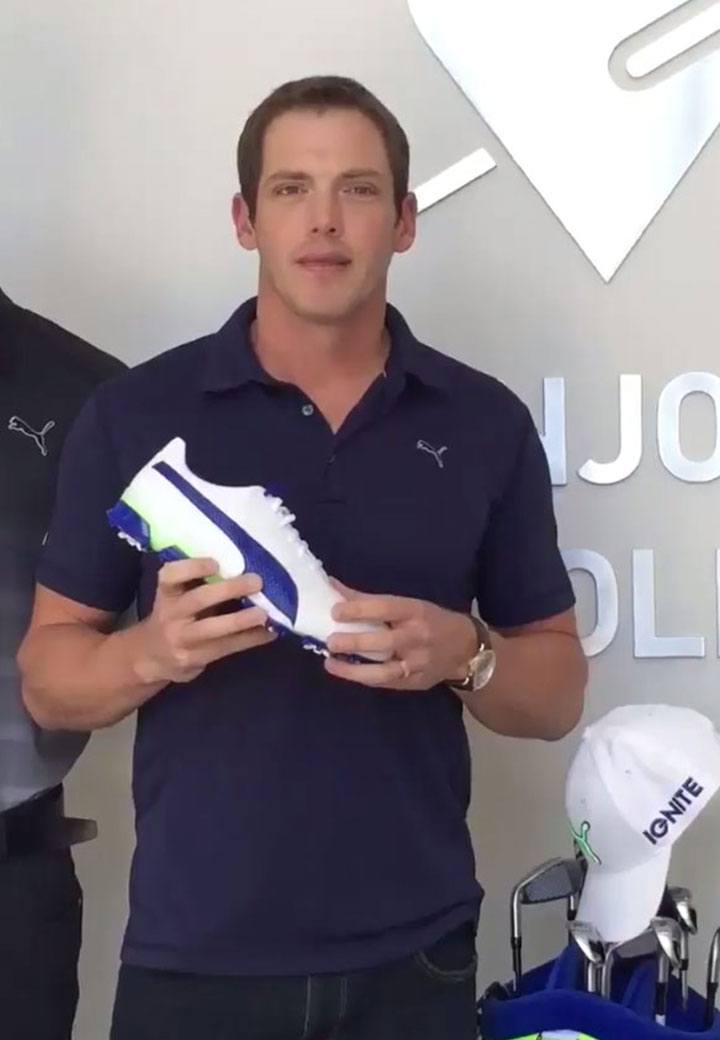 Man holds PUMA Titantour shoe