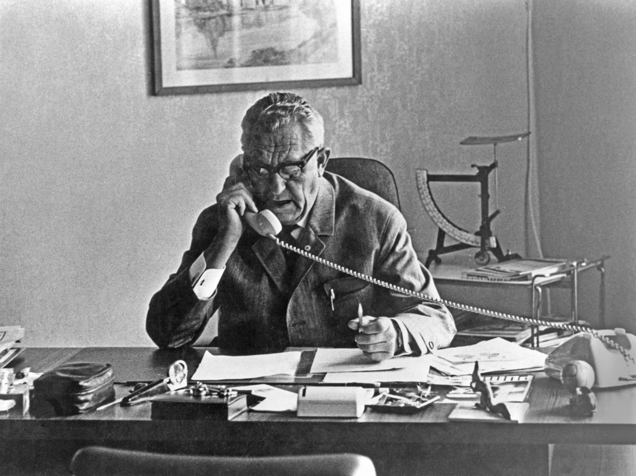 Black and white photo of Rudolf Dassler in his office